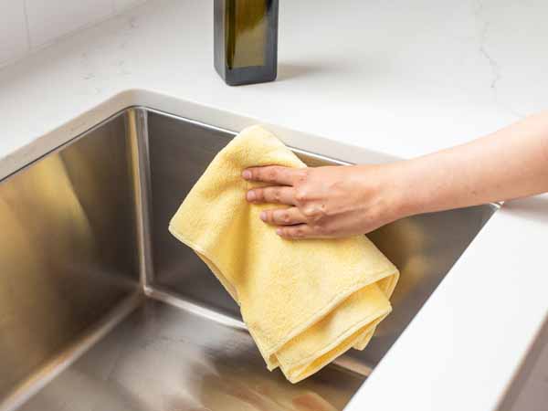 Clean Stainless Steel Sink With Soft Towel